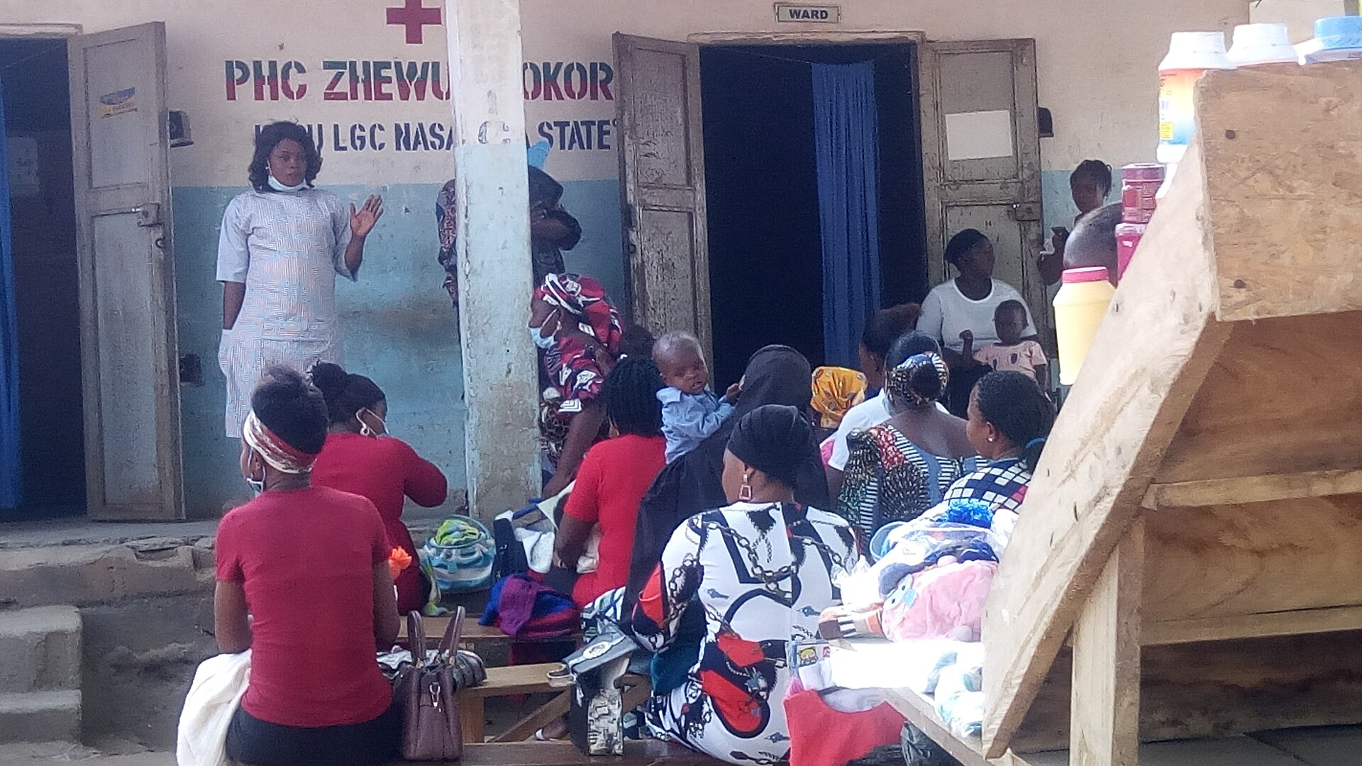 Health workers speaking with mothers during immunisation education at a primary health centre in Masaka, Nigeria.